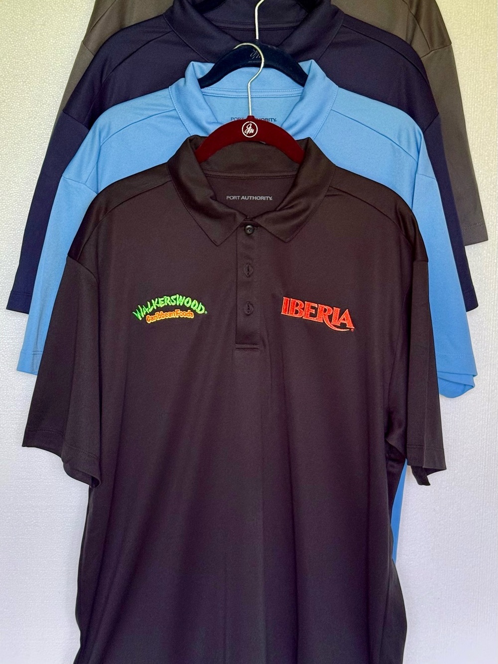 Port Authority Black Polo with Red Iberia and Green Walkerswood Logos